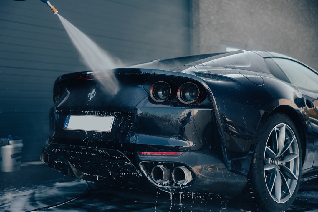 a-car-being-washed-with-a-high-pressure-washer-ojtodra8sta