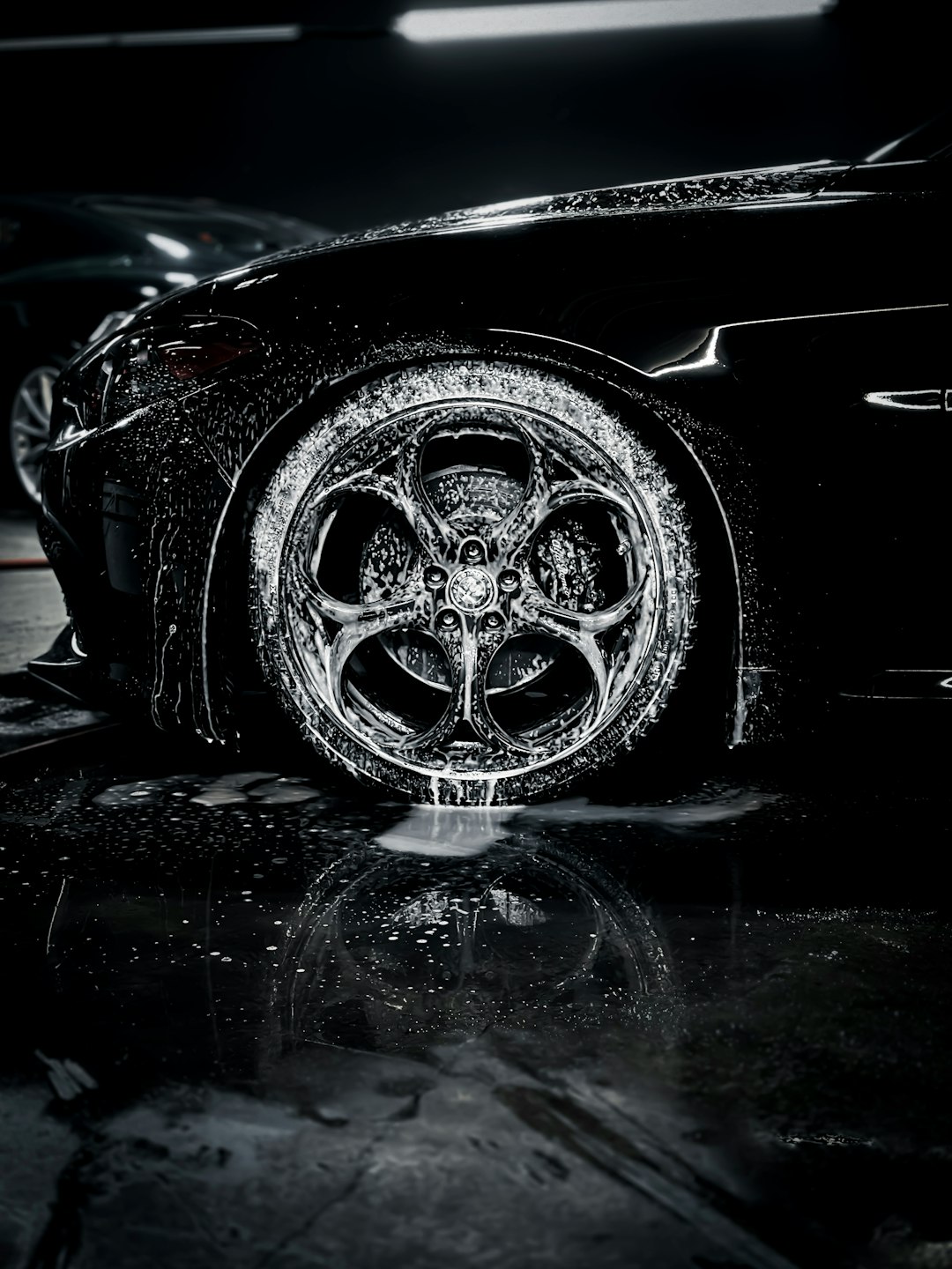 hero-img-01 a-close-up-of-a-car-tire-on-a-wet-surface-m5g2ifroucs
